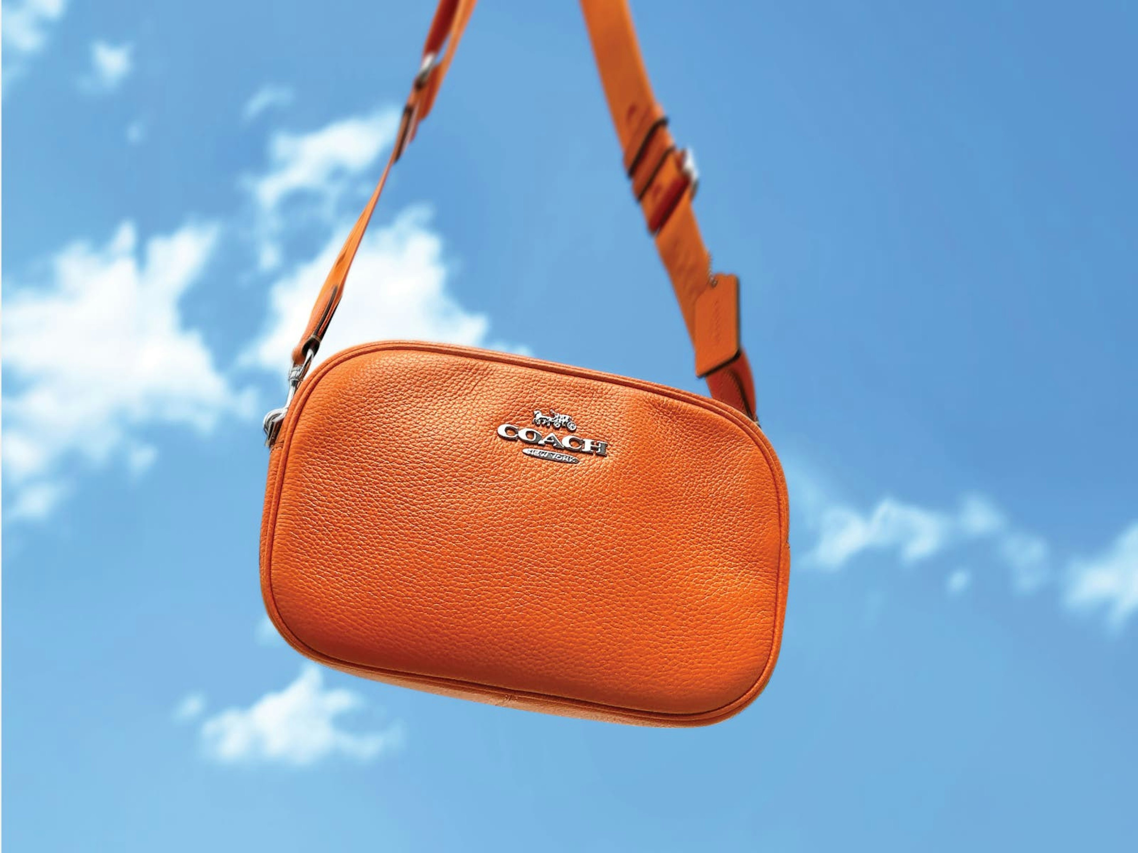 orange coach sling purse